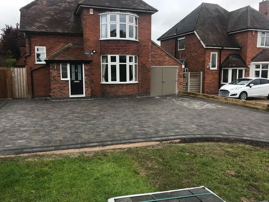 Block paved driveway with charcoal border course